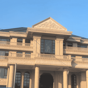 咸宁黄金麻别墅外墙干挂石材效果示例